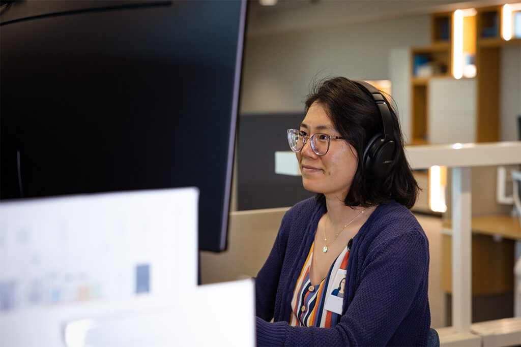 Women sitting at desk taking a call