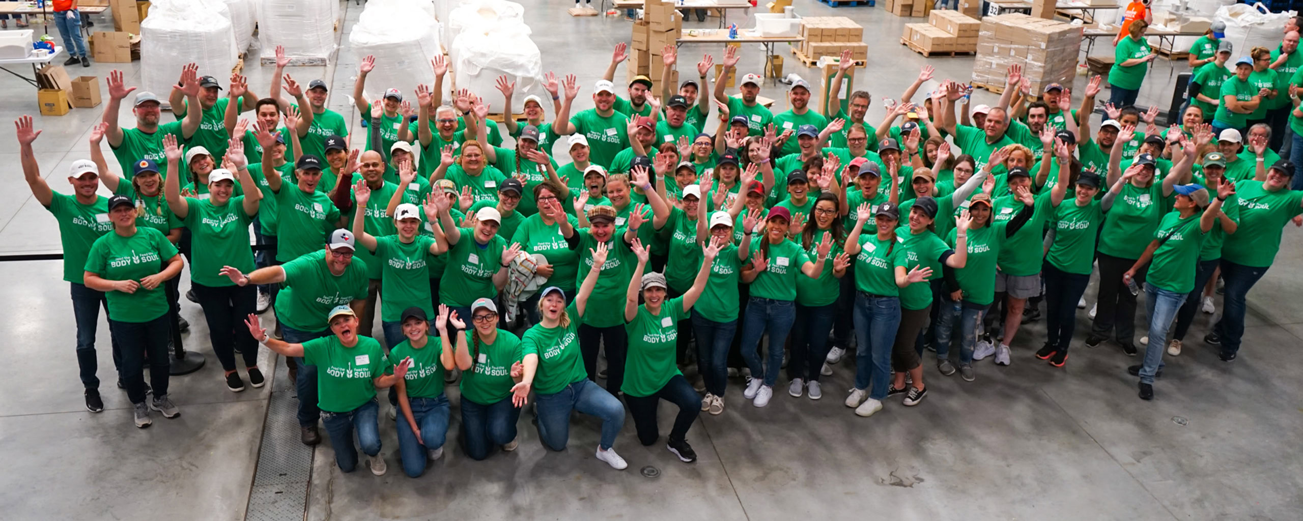 U.S. Venture team members wearing green shirts during a community volunteer event