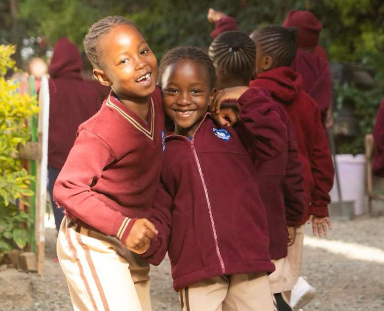 Two Kenya Works students at school